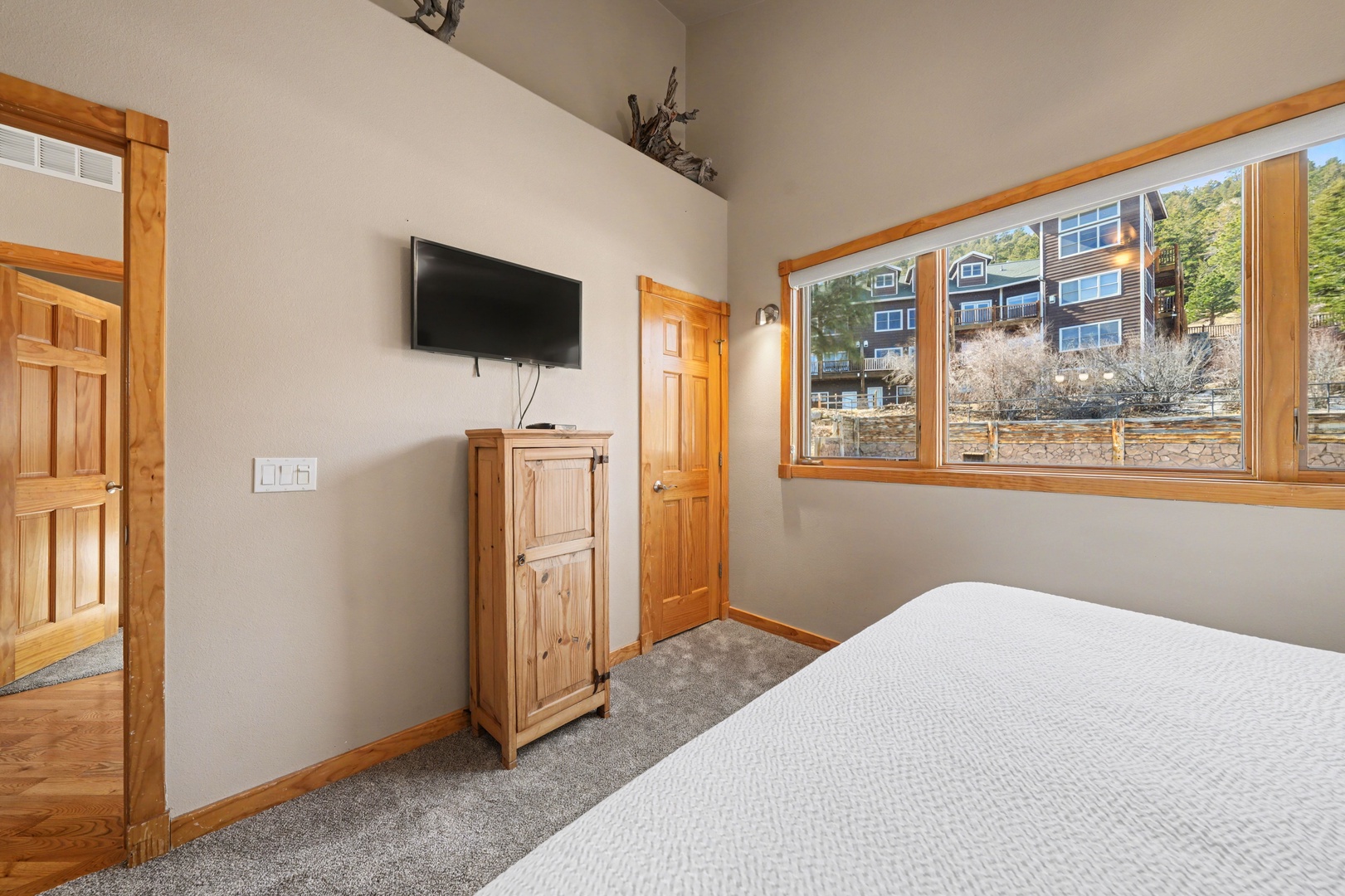 Relax and watch a movie on the flat screen TV from the primary bedroom before drifting off to sleep