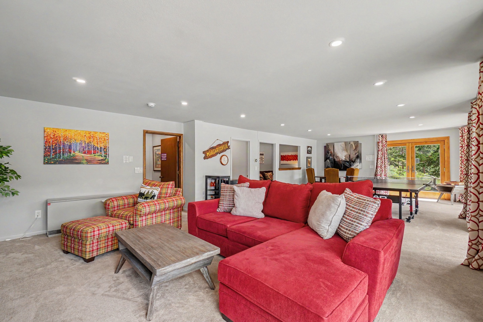 Unwind in the spacious lower level, complete with comfortable seating perfect for lounging.