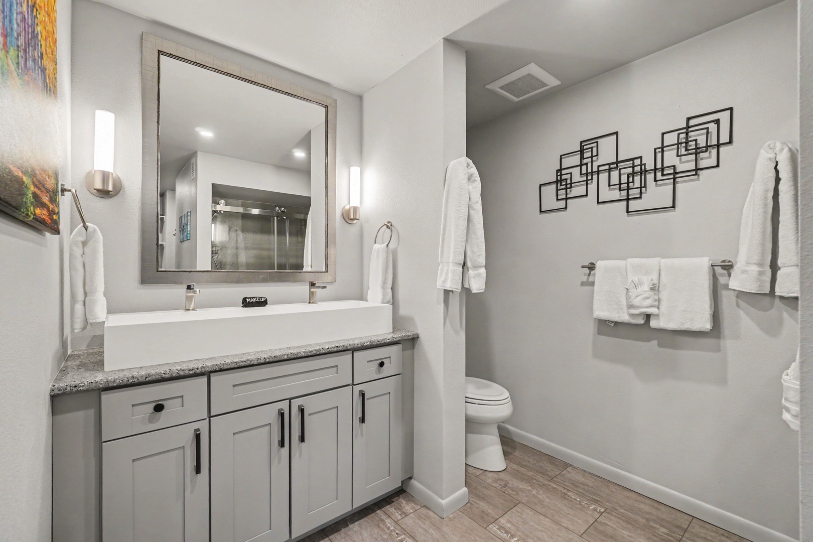 Freshen up in your private bathroom with shower and unique vessel sink.