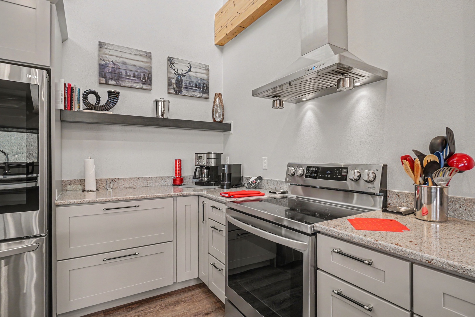 Prepare your favorite meals in this fully equipped kitchen featuring stainless steel appliances, granite countertops, and all the cookware you need.