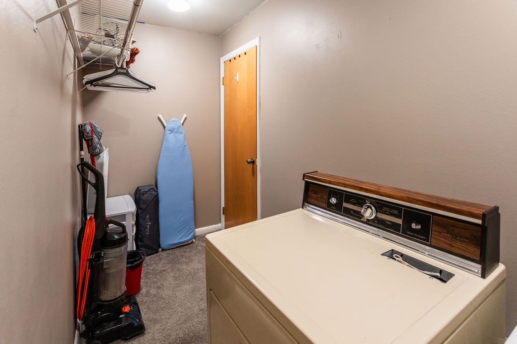Your dedicated laundry room keeps you organized with a full-size washer, dryer, ironing board, and plenty of storage space.