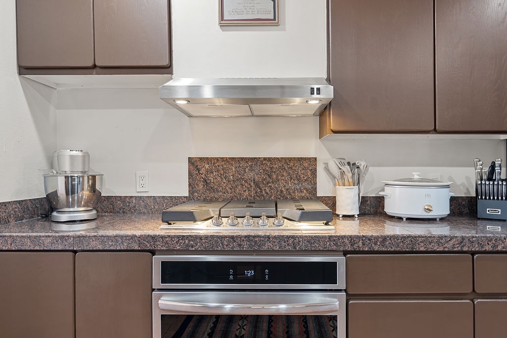 Your fully equipped kitchen features granite countertops, stainless steel appliances, and everything needed to prepare delicious meals during your stay.