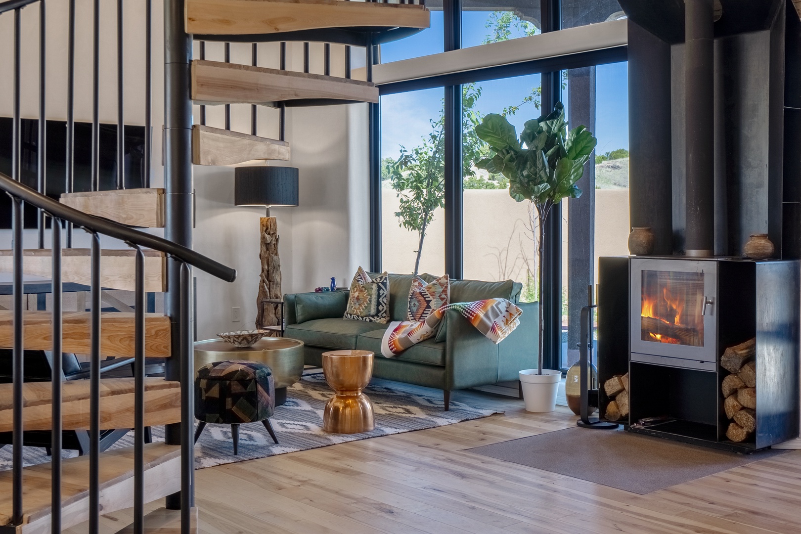 Unwind in this stunning living space where modern design meets cozy comfort. A crackling fireplace and thoughtful details create your perfect retreat.
