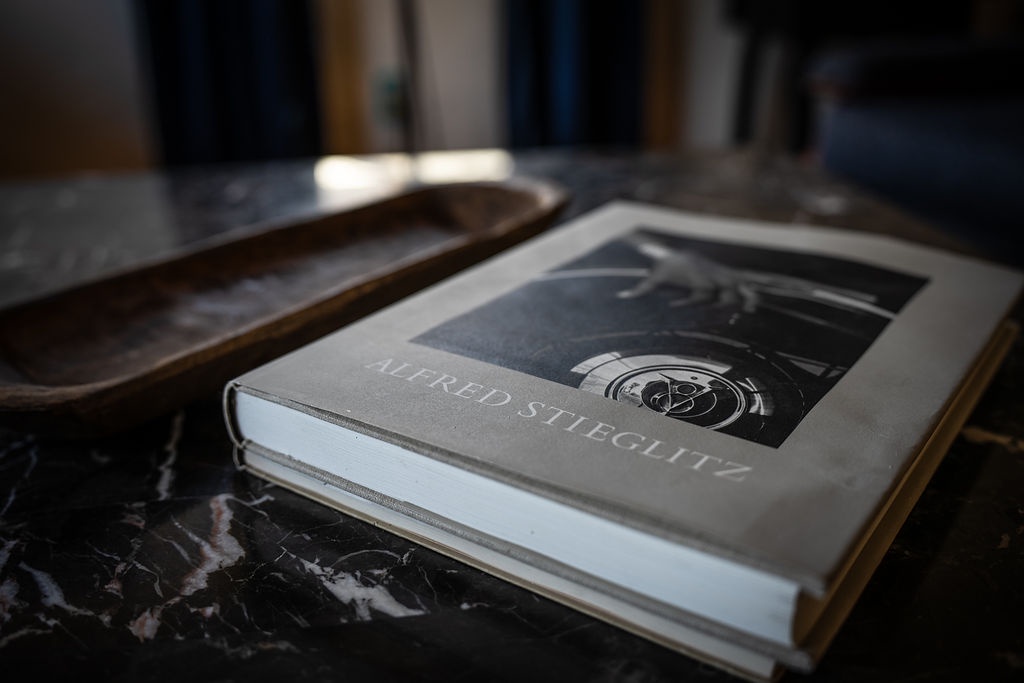 Curl up with a good book on elegant marble surfaces, perfect for your quiet reading moments.