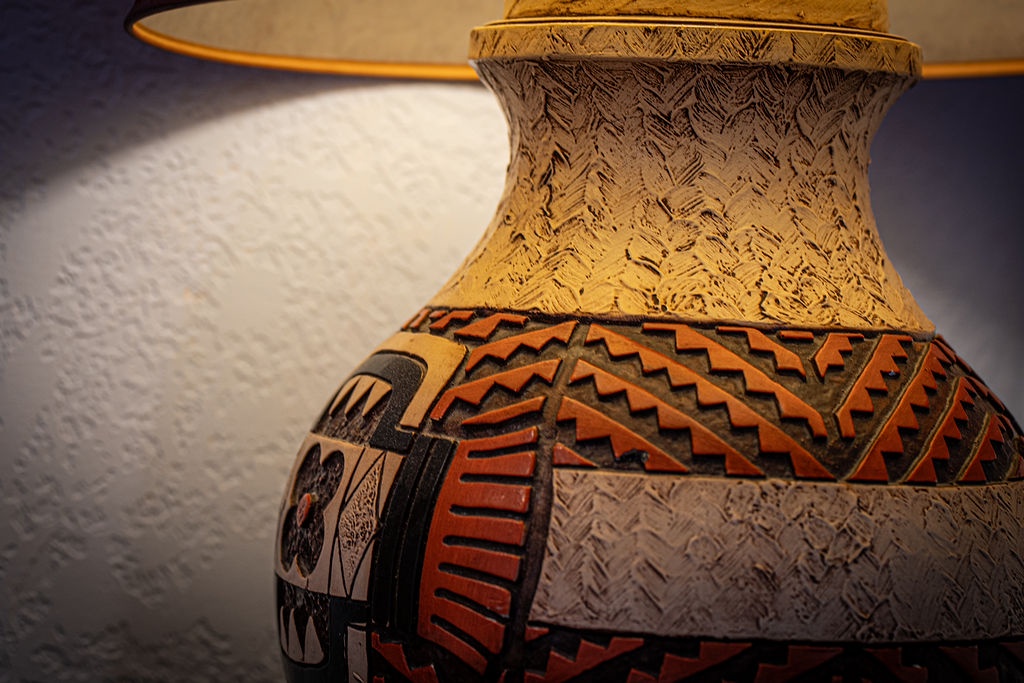 Handcrafted pottery displays intricate Native American patterns, adding authentic cultural artistry to your comfortable retreat.