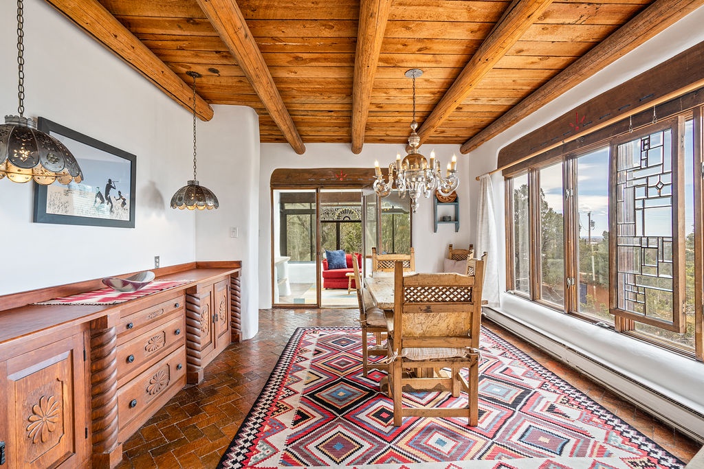 Step into your charming dining space where rustic wooden beams meet authentic Southwest style, creating the perfect spot for memorable meals.