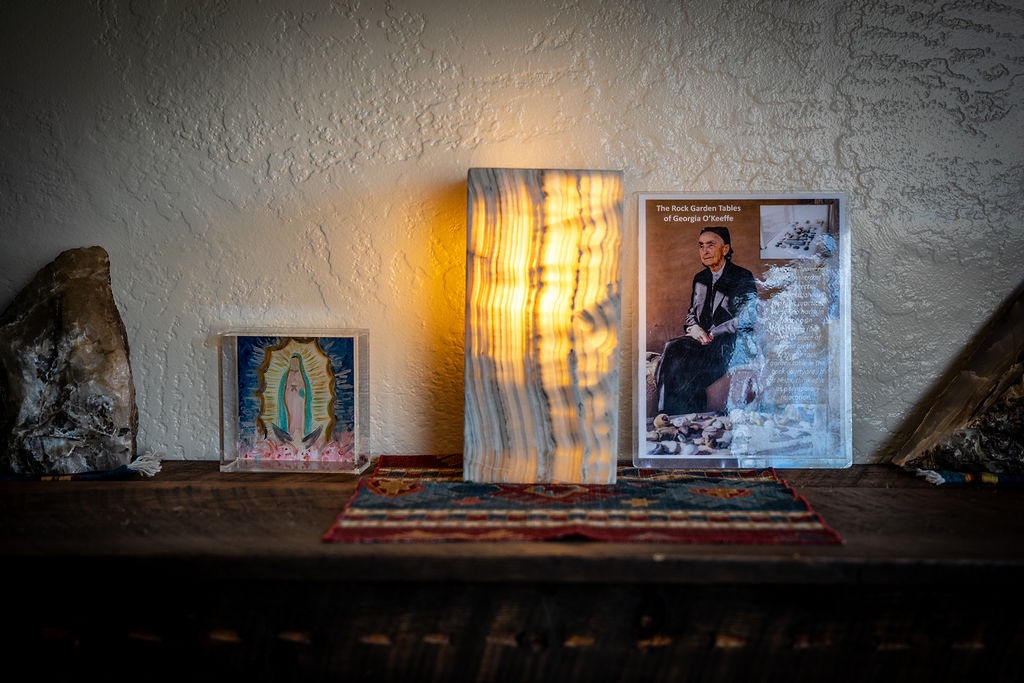 You'll find thoughtful artistic touches throughout your space, where warm lighting creates an inviting atmosphere perfect for relaxation.