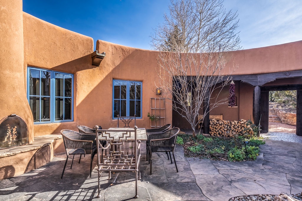 Warm adobe walls and stone patios create your perfect southwestern retreat, complete with outdoor fireplace for cozy evenings.