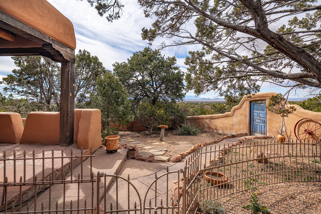 Step into your private adobe courtyard, where ancient trees frame desert vistas and Southwestern charm creates your perfect retreat.