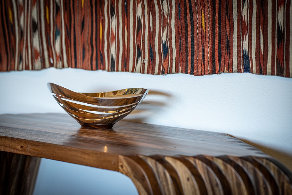 Warm wooden accents and vibrant textiles create your perfect retreat, where thoughtful design meets comfort in every detail.