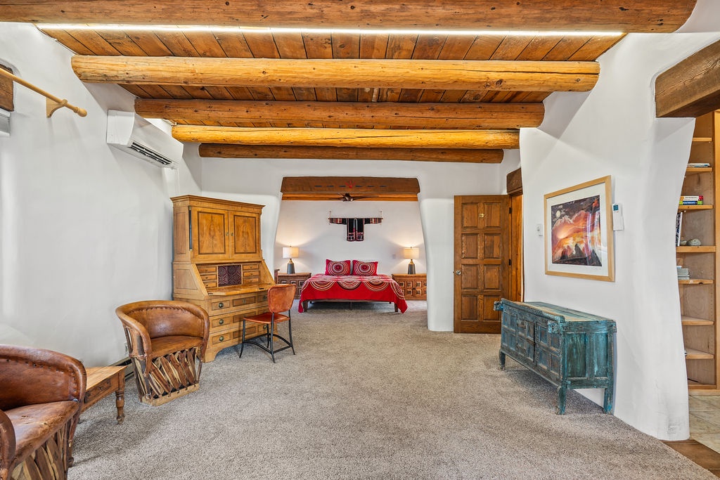 Step into your spacious suite where rustic charm meets comfort—exposed wooden beams, authentic furnishings, and handcrafted details create a truly memorable retreat.