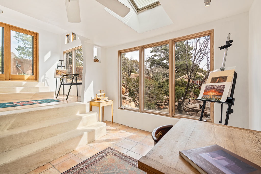 Your bright artist studio awaits with soaring ceilings, skylights, and peaceful natural views to inspire your creative moments.