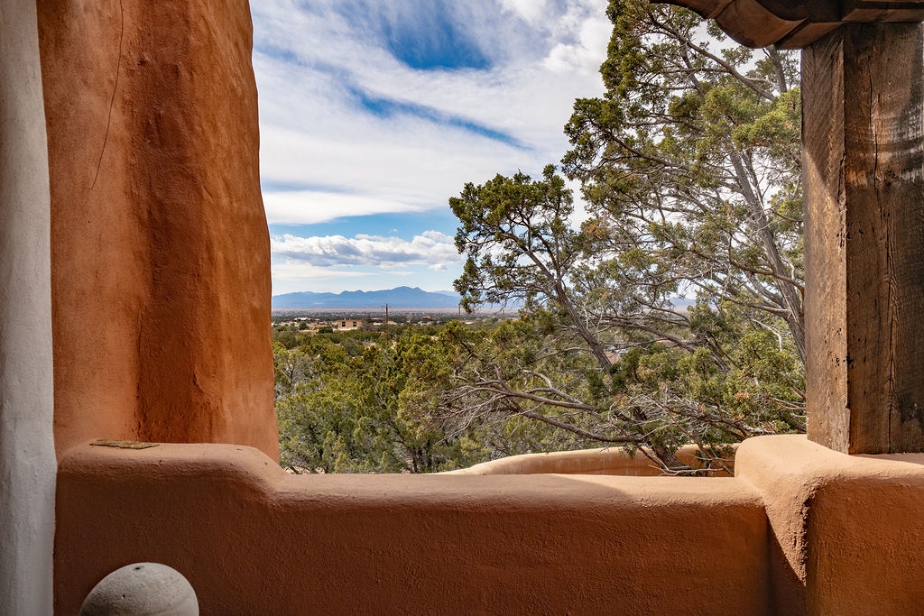Step onto your private terrace and soak in sweeping mountain vistas framed by ancient adobe walls and desert trees.