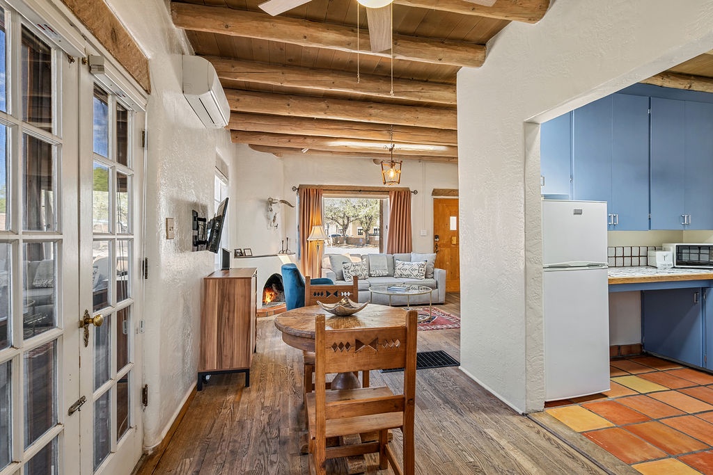 Your charming adobe retreat features exposed ceiling beams, a cozy fireplace, and an open layout perfect for unwinding after exploring.