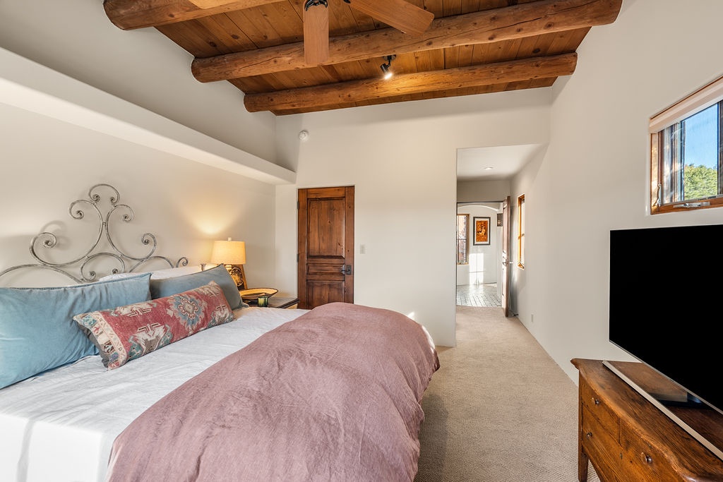 Relax in your charming bedroom with cozy bedding, and peaceful views through the window.