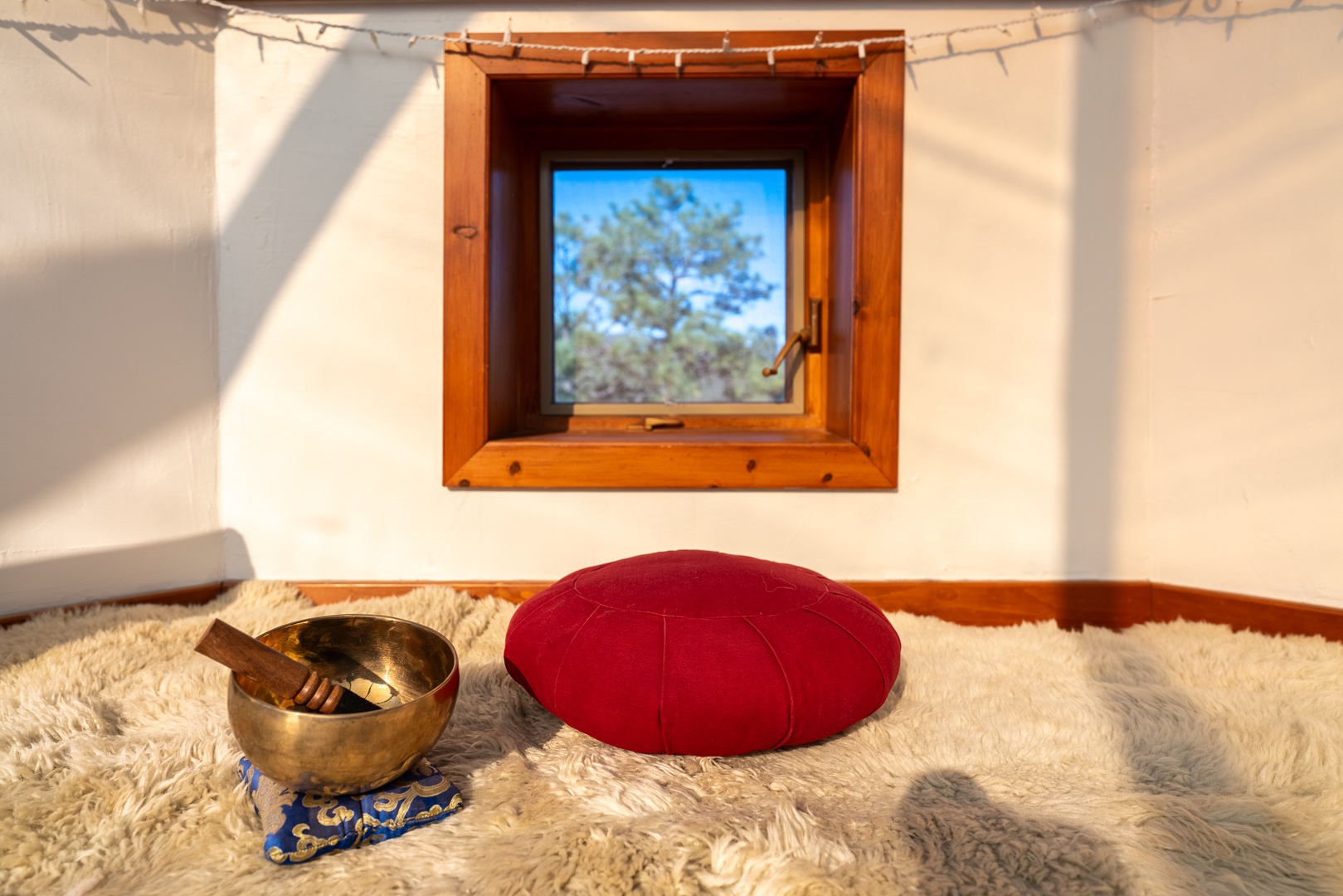 Unwind in this serene meditation corner, where soft natural light and plush textures create your perfect space for peaceful reflection and relaxation.