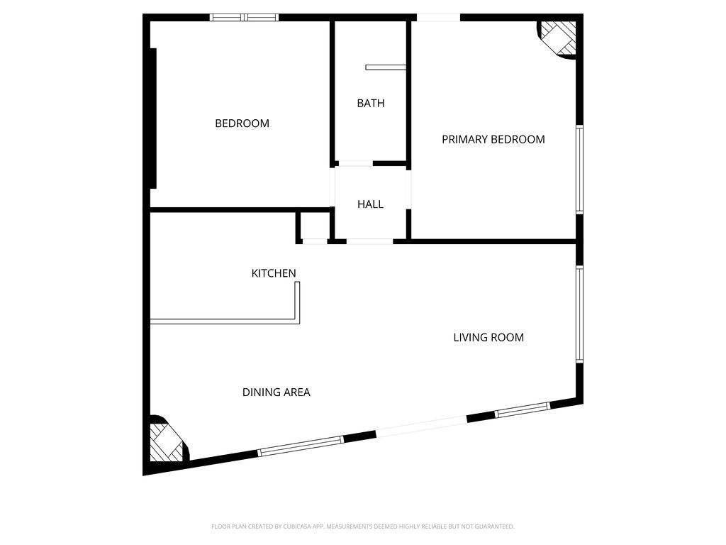This detailed floor plan shows your spacious two-bedroom layout with open living and dining areas, perfect for planning your stay.