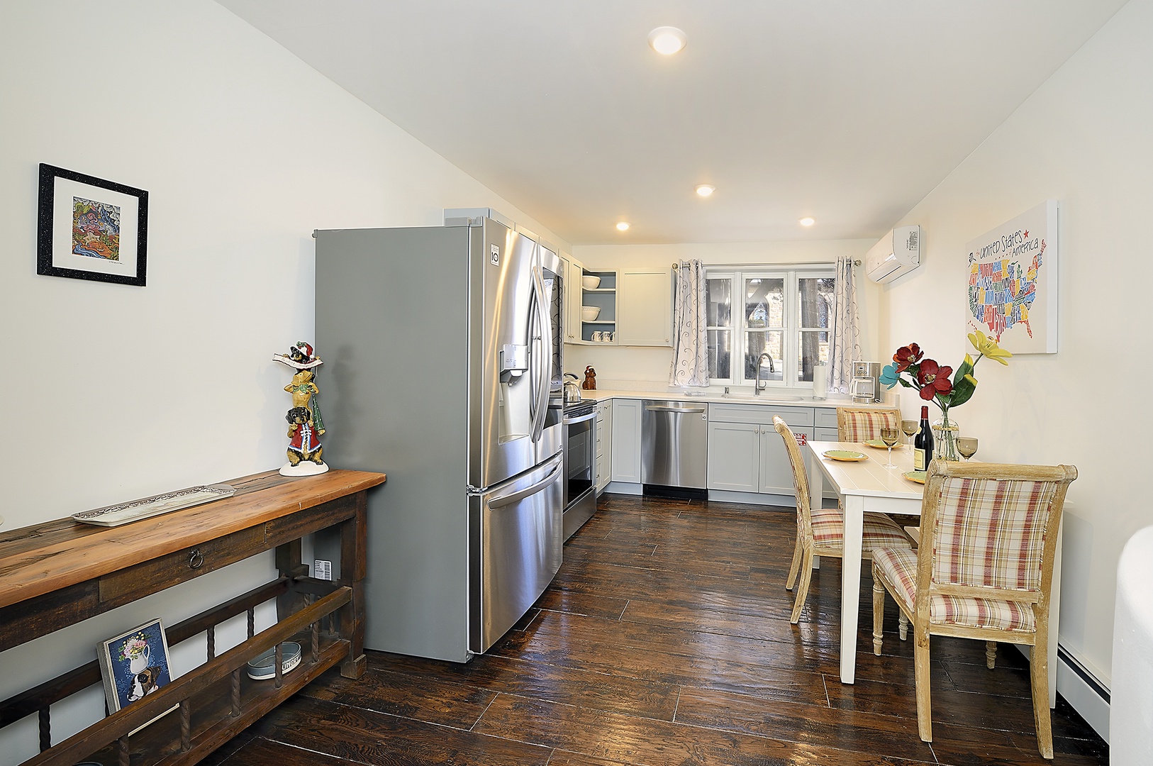 Your fully equipped kitchen invites culinary adventures with stainless steel appliances and cozy dining nook for memorable meals together.
