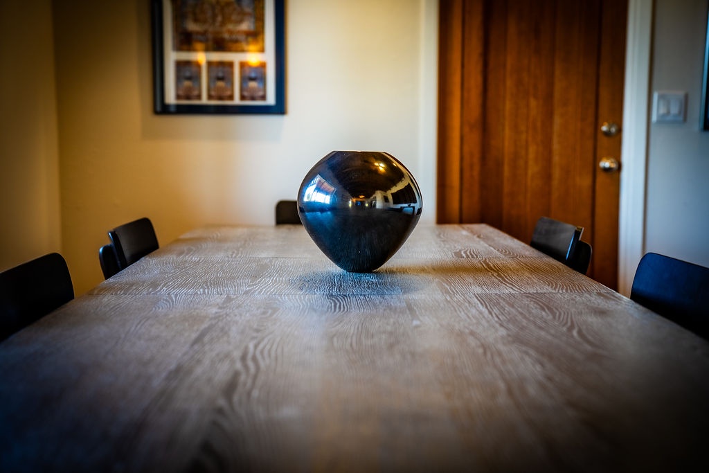 Gather around this stunning wood dining table for memorable meals and conversations in your thoughtfully designed space.