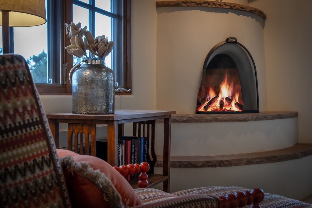 Curl up with a book by your crackling fireplace, where warm flames create the perfect ambiance for peaceful evenings.