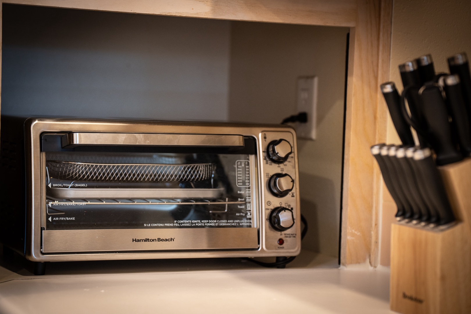 Your kitchen comes equipped with a convenient toaster oven and quality knife set for all your cooking needs.