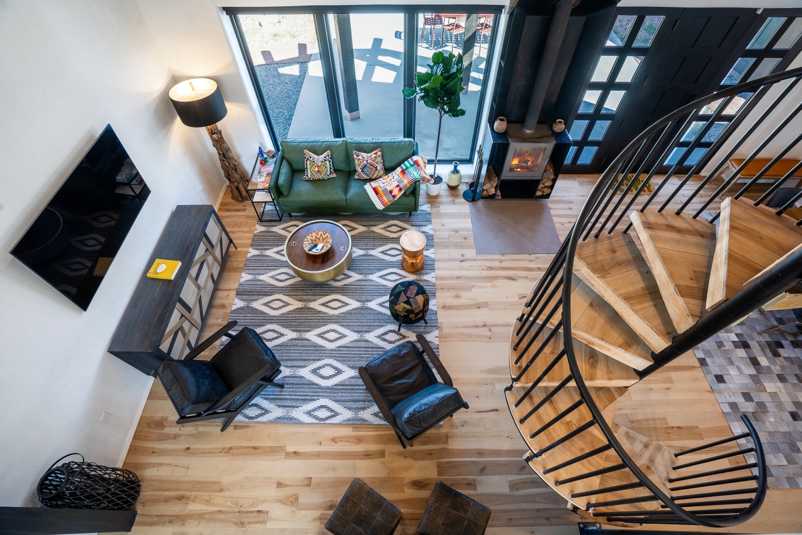 Unwind in your stylish living space with soaring ceilings, cozy fireplace, and thoughtfully curated furnishings that create the perfect retreat.