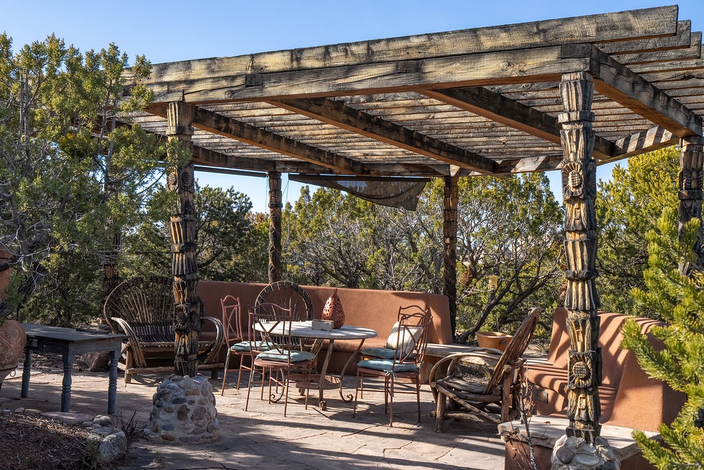 Relax under your private pergola where rustic charm meets comfort—perfect for morning coffee or evening conversations surrounded by nature.