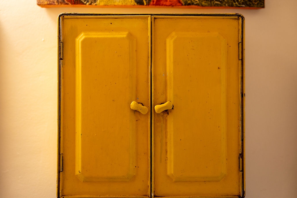 These charming vintage yellow doors add character and warmth to your space, creating a welcoming atmosphere with their rustic charm.