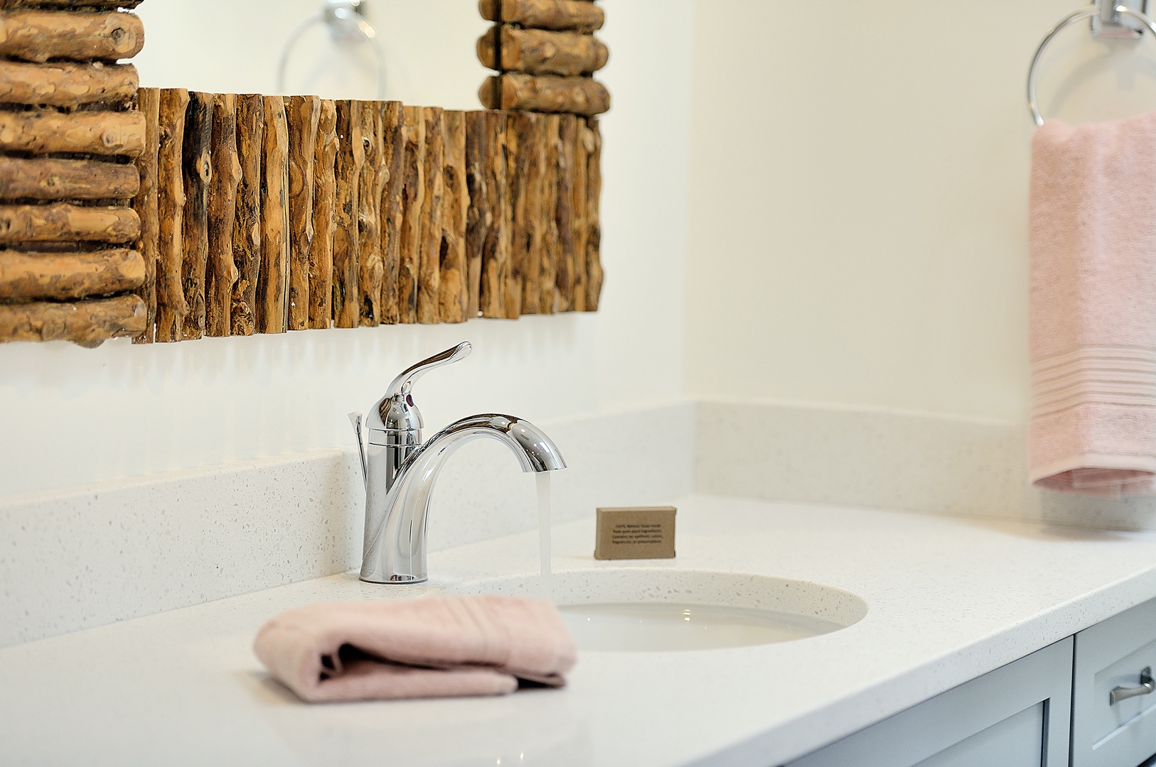 You'll love the rustic charm of your bathroom's reclaimed wood mirror and pristine marble countertop with luxury amenities.