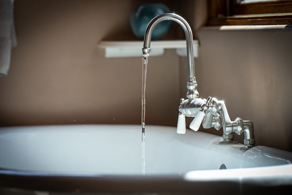 Your kitchen sink awaits with crystal-clear water flowing from the polished faucet, ready for cooking adventures and easy cleanup.