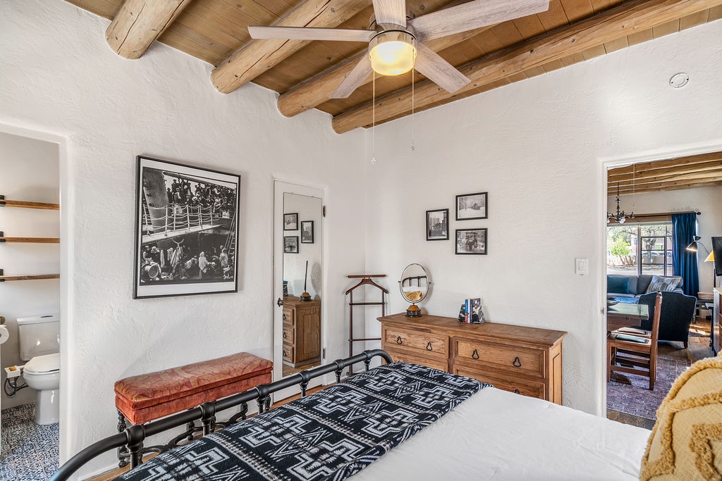 Drift off under rustic vigas with southwestern charm enveloping your cozy retreat, complete with vintage touches and artful décor.