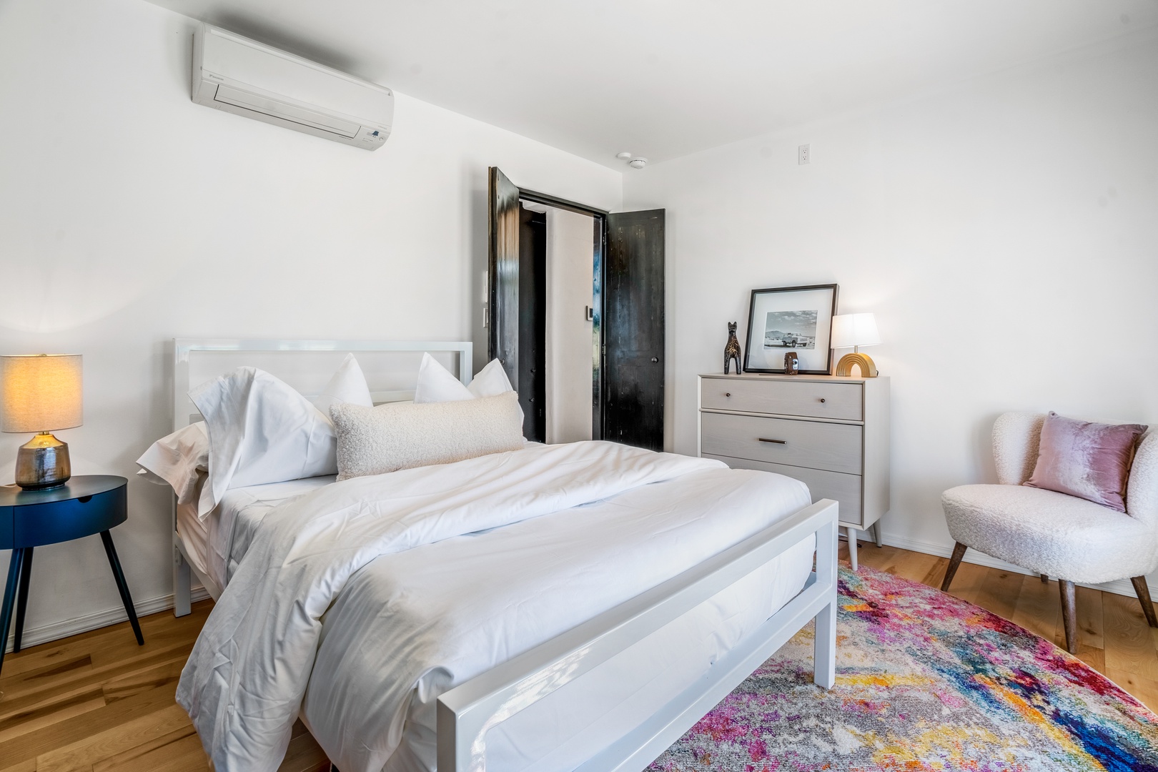 Unwind in your serene bedroom with crisp linens, cozy reading nook, and climate-controlled comfort for perfect rest.