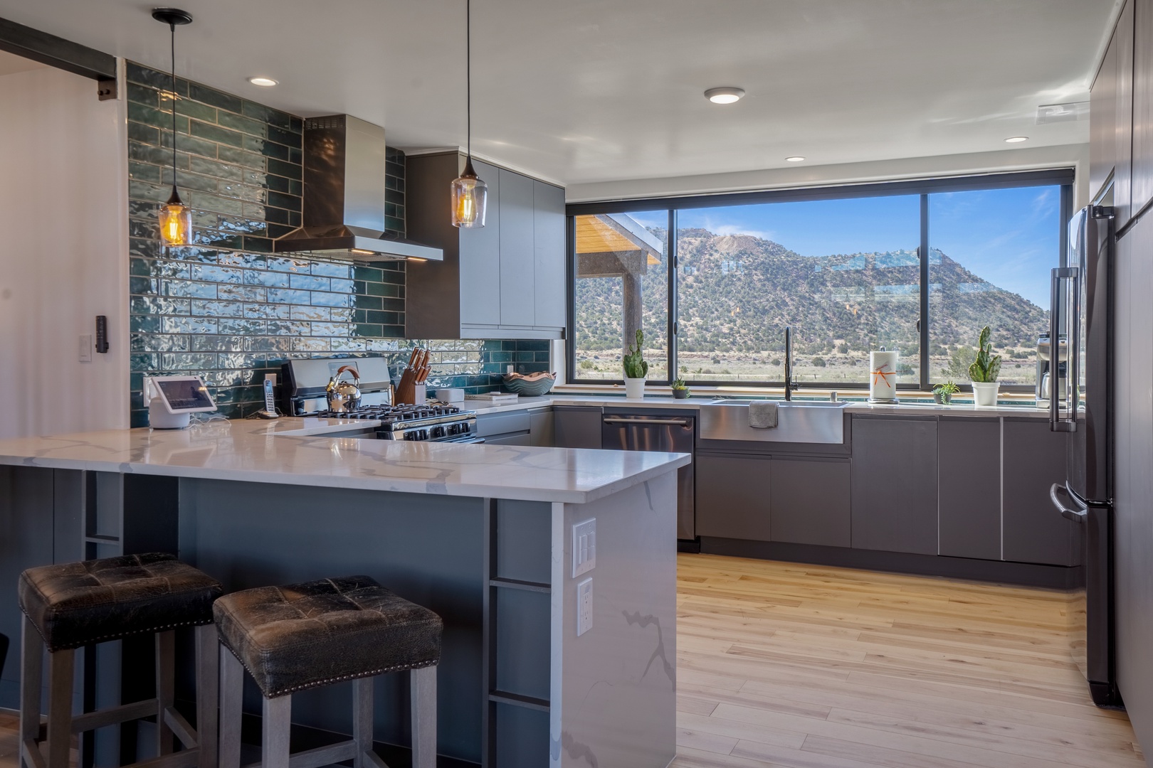 Your dream kitchen awaits with sleek granite counters, premium stainless appliances, and breathtaking mountain views that inspire every meal you'll create.