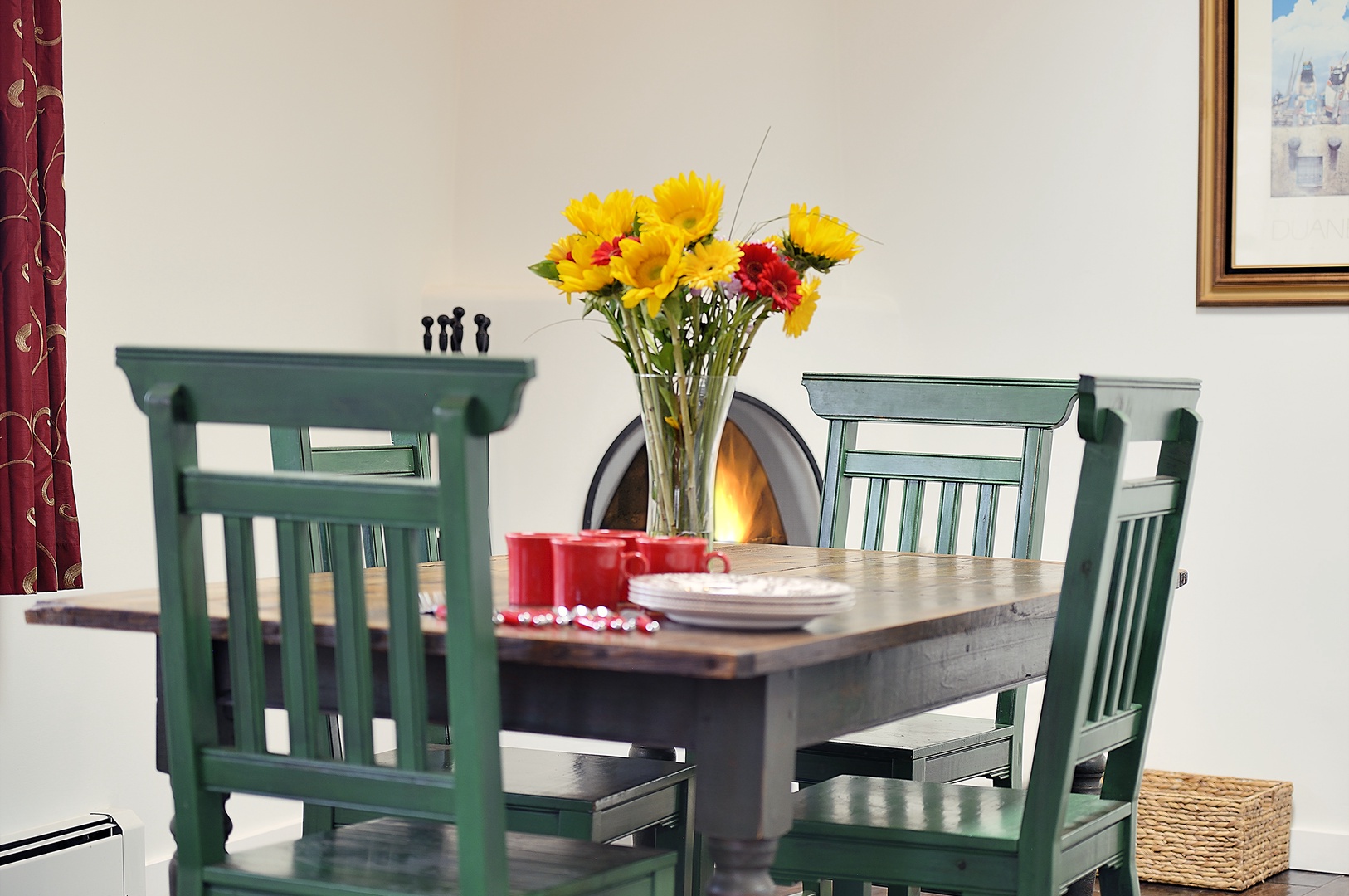 Gather around your charming dining table with fresh flowers and cheerful touches that make every meal feel special.