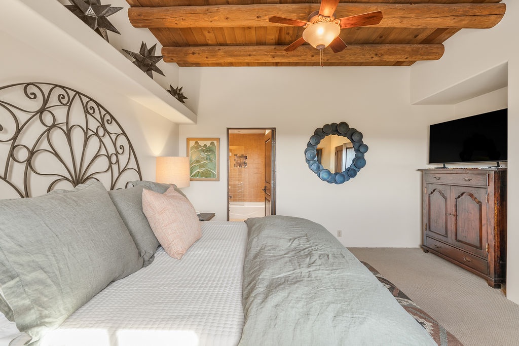 Rest peacefully in your cozy bedroom featuring exposed wood beams, elegant ironwork, and a private ensuite for your comfort.