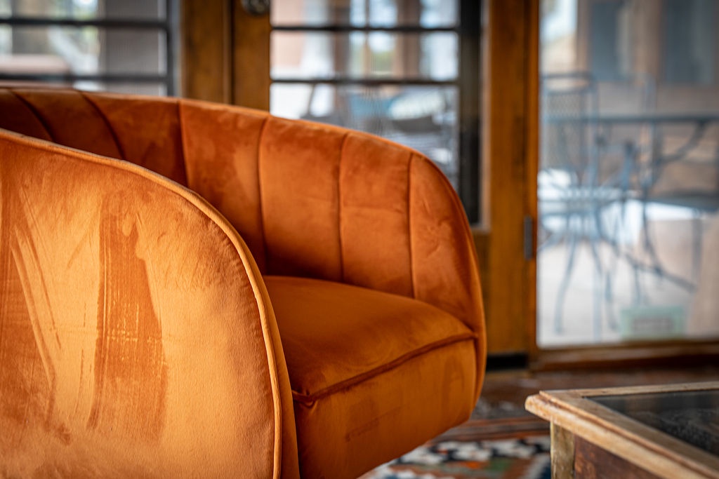 Sink into this plush velvet armchair and feel instantly at home in your stylish retreat.