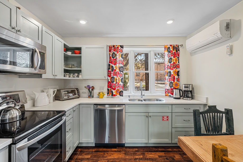 Your fully-equipped kitchen features modern appliances and cheerful accents, perfect for preparing meals during your stay.