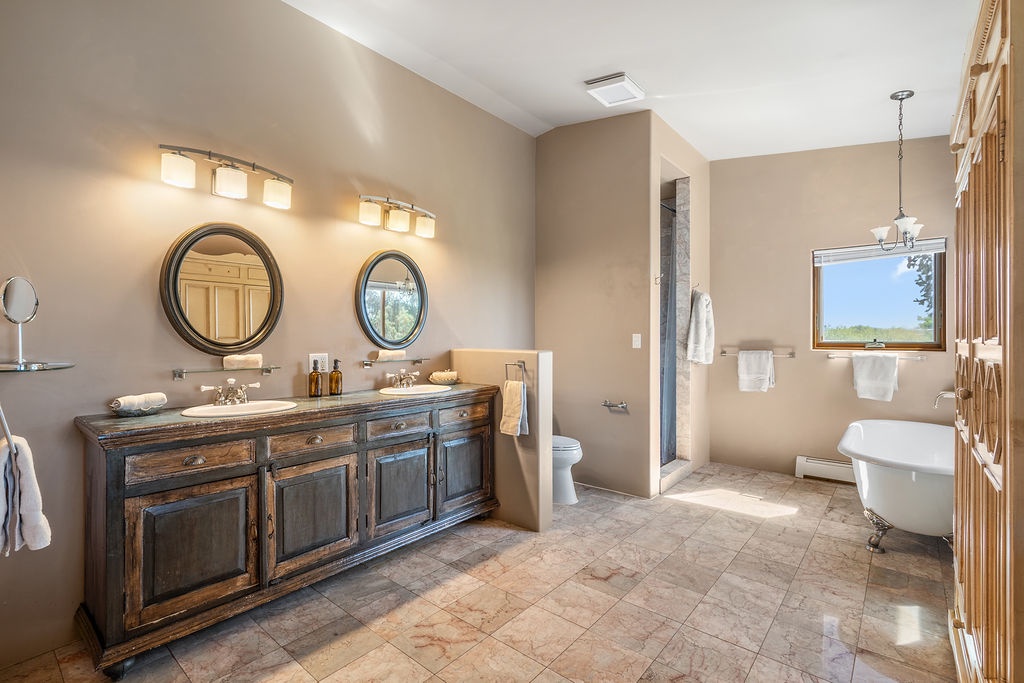 Unwind in your spacious master bathroom featuring dual vanities, a luxurious soaking tub, and elegant finishes that create your perfect retreat.