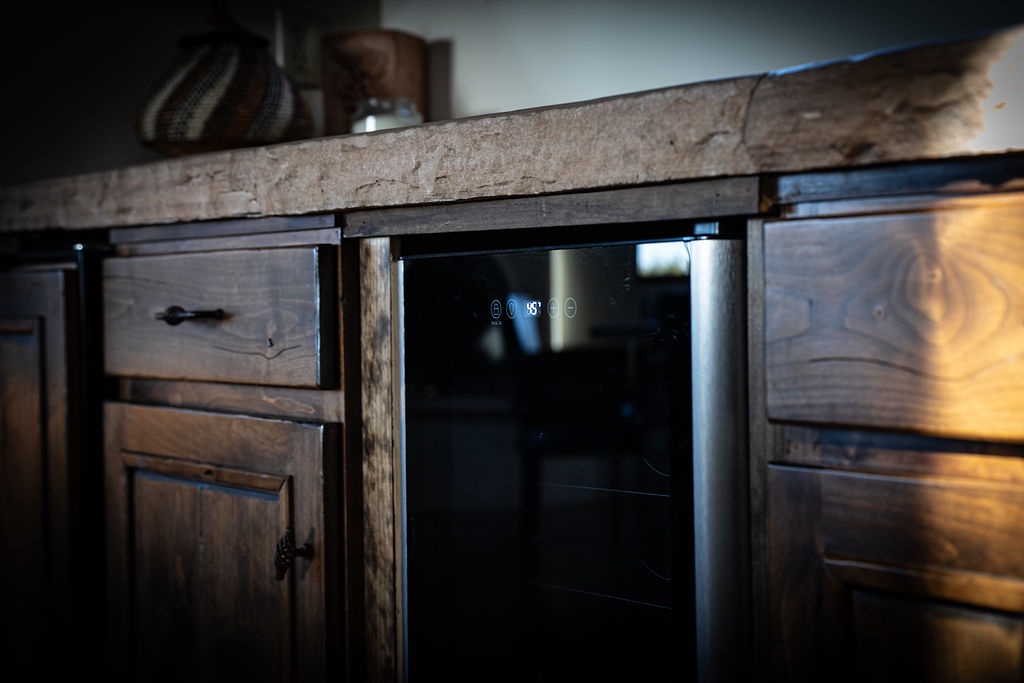 Your kitchen features a sleek built-in beverage cooler perfect for chilling your favorite drinks after exploring the area.