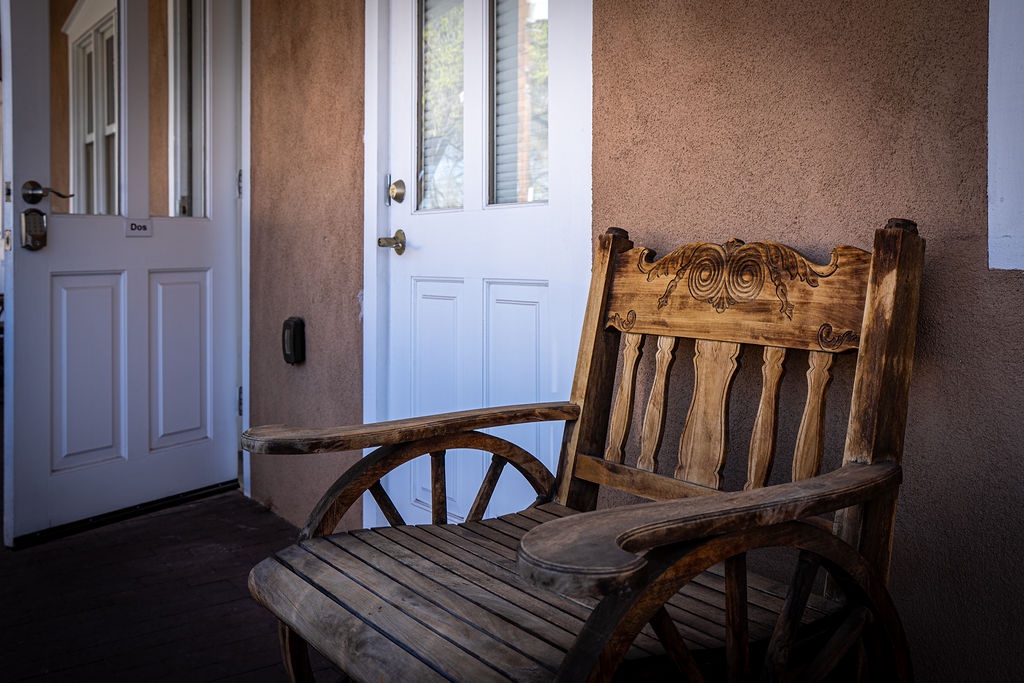 Your private entrance welcomes you with a charming handcrafted wooden bench, perfect for enjoying quiet moments.