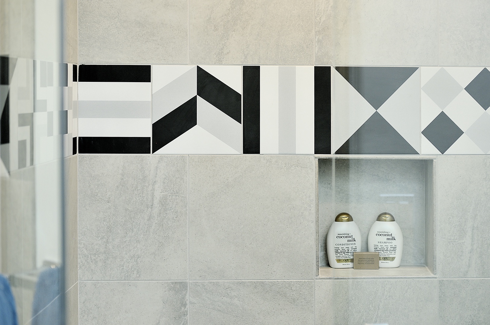 Your shower features a built-in niche stocked with quality coconut milk toiletries, adding convenience to your daily routine.