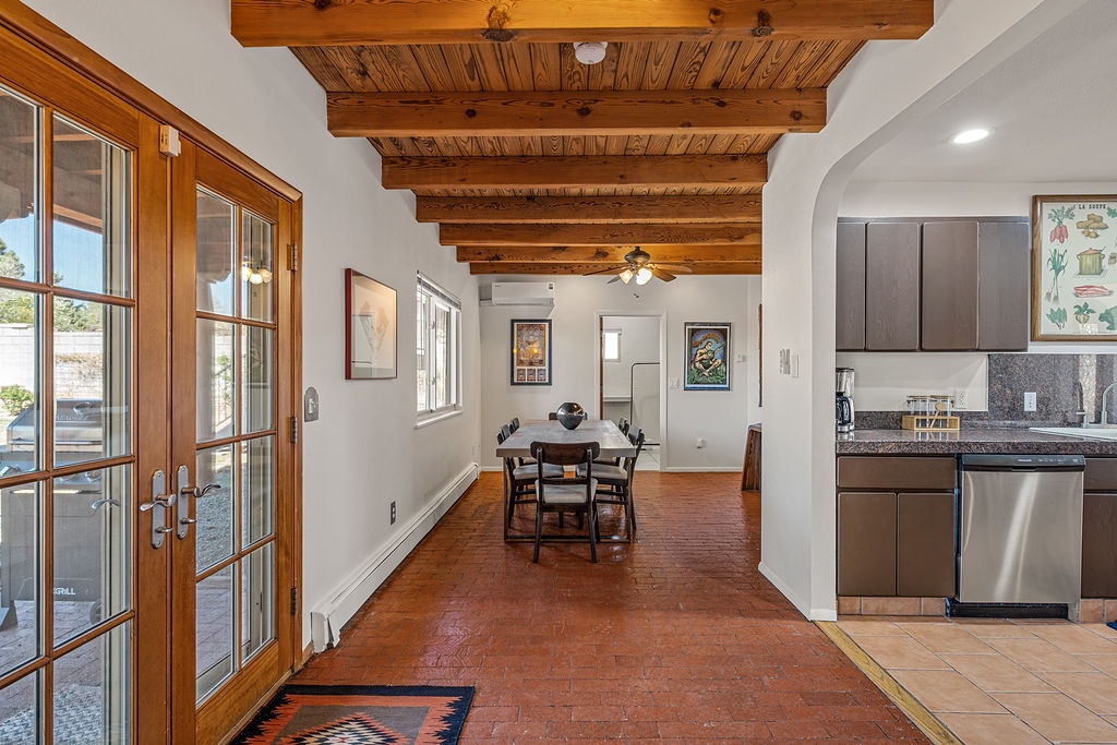 Step into your southwestern retreat with exposed wooden beams overhead and warm terracotta floors beneath your feet.