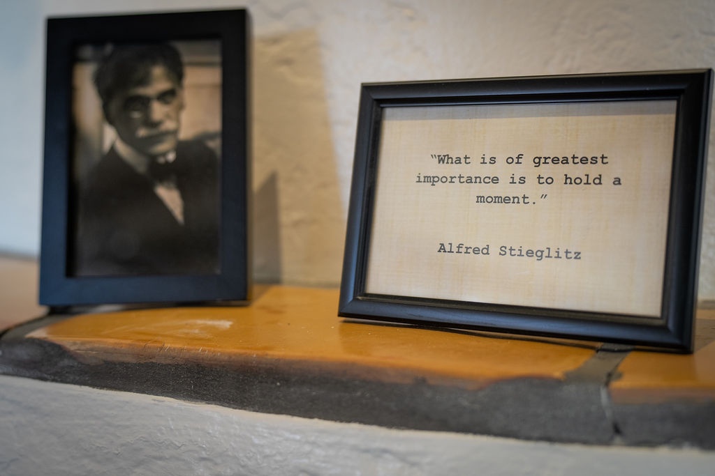 Thoughtful touches like inspiring quotes and vintage portraits create a warm, cultured atmosphere in your living space.