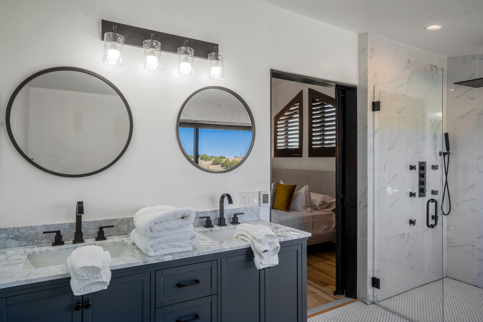 Your luxurious ensuite features dual vanities, marble shower, and modern fixtures for ultimate comfort.