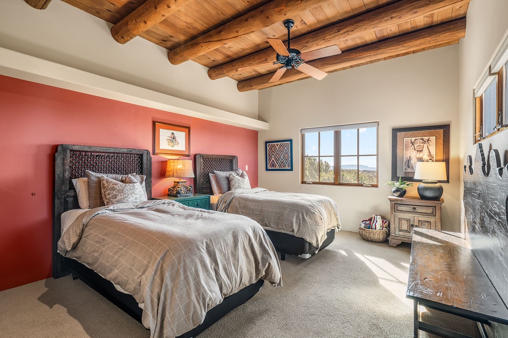Rest peacefully in your twin bed retreat, where exposed beam ceilings and warm adobe colors create the perfect southwestern sanctuary.