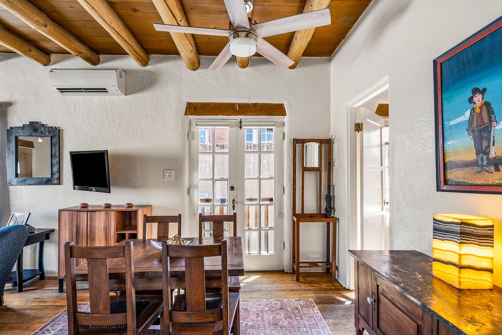 Gather around your rustic dining table where southwestern charm meets modern comfort in this inviting space.