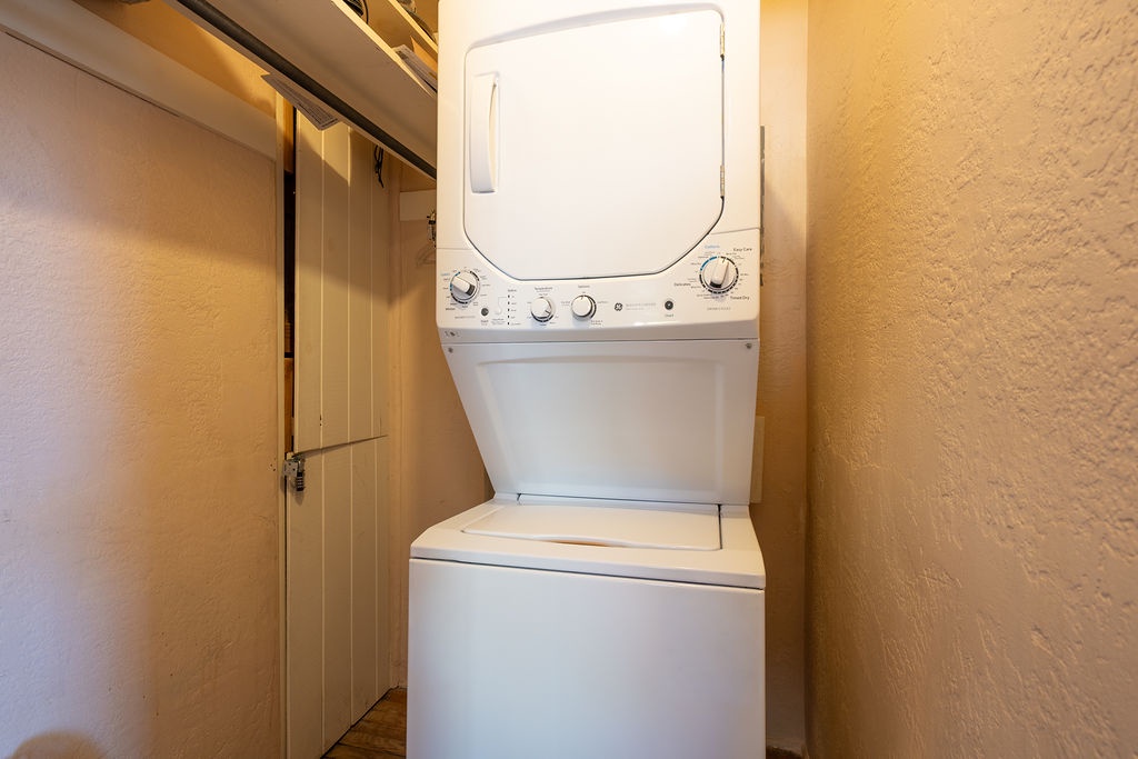 Your in-unit washer and dryer keeps your clothes fresh throughout your stay, tucked away in this convenient closet space.