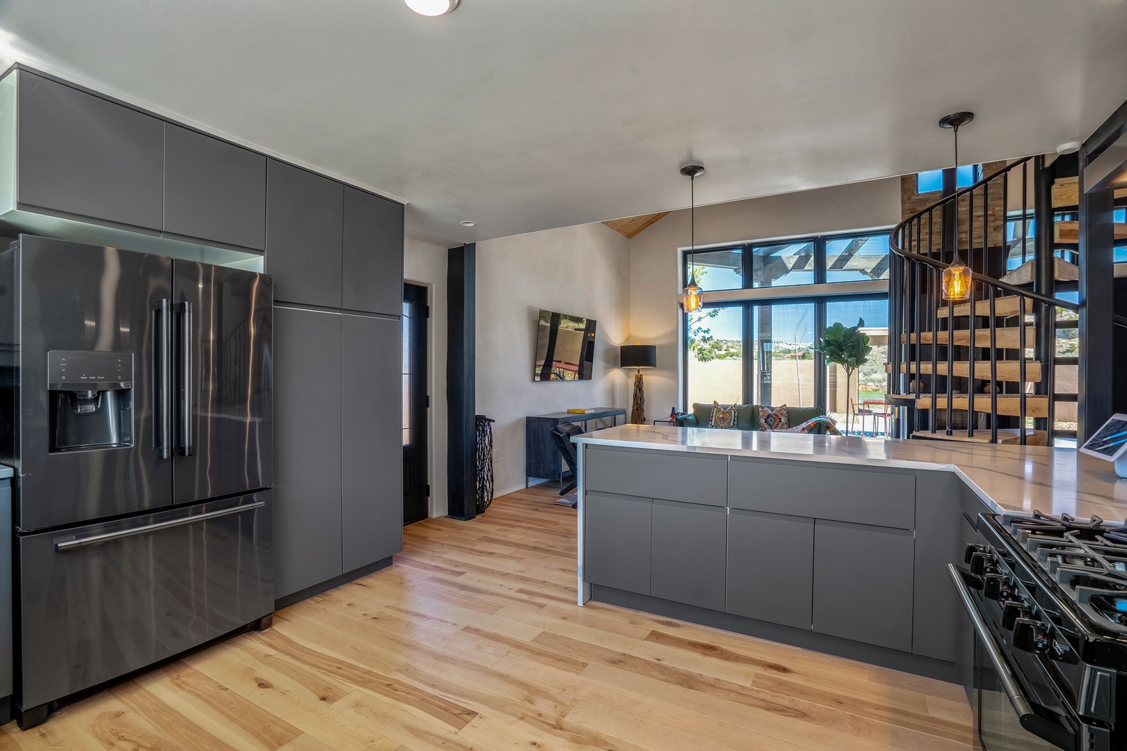 Your sleek chef's kitchen features premium stainless steel appliances and a spacious island perfect for culinary adventures.