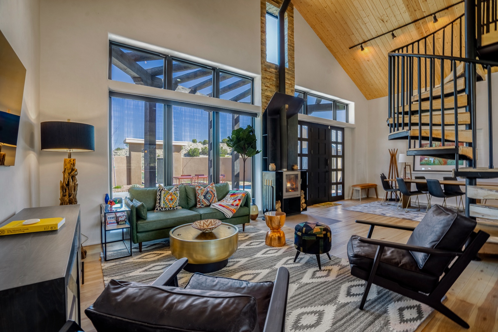 Unwind in this stunning open-concept living space with soaring ceilings, cozy fireplace, and vibrant Southwest-inspired décor that creates your perfect mountain retreat.