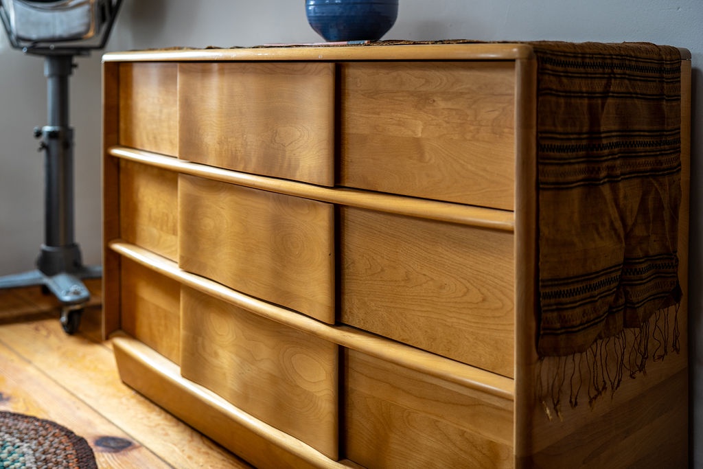Store your belongings in this beautiful natural wood dresser with ample drawer space for organized, comfortable living.